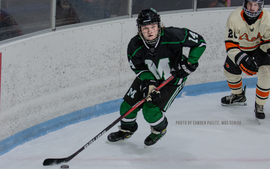 player skating forward with puck